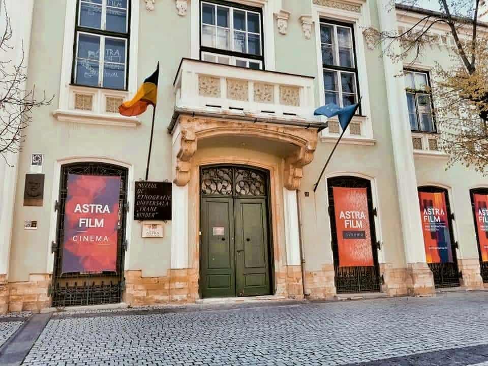 Building in Piata Mica with signs for Astra Film Festival in Sibiu, Romania