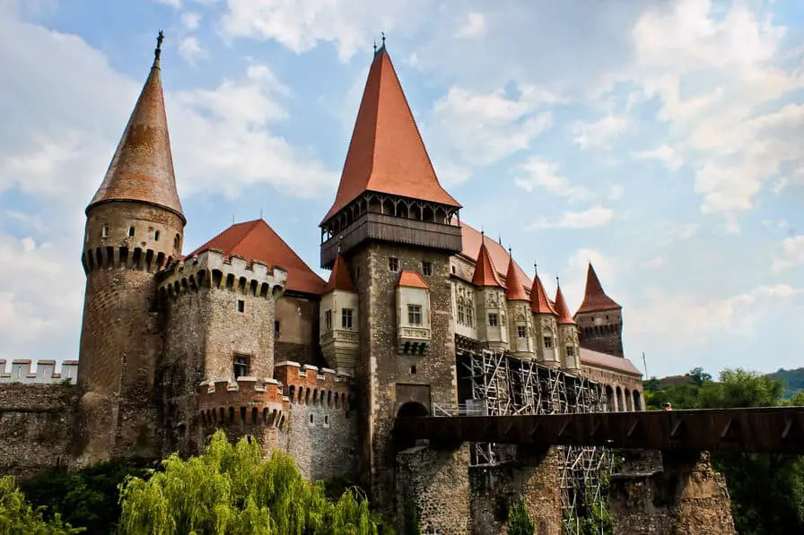 Iconic shot of Corvin Castle with bridge, moat, and towers.
