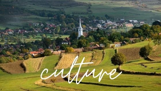 Culture graphic with Transylvanian village in the background.