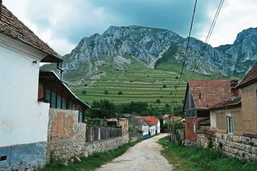 Szelek village in Transylvania with mountain backdrop.