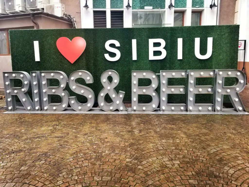 where to eat in sibiu - ribs and beer i <3 sibiu sign