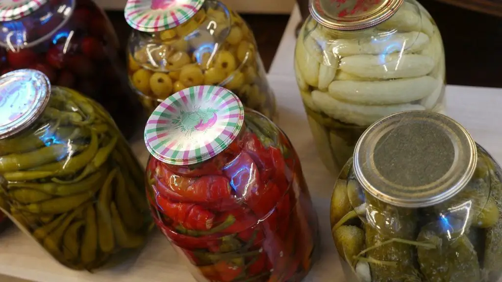 Jars of different pickles, pickled vegetables.