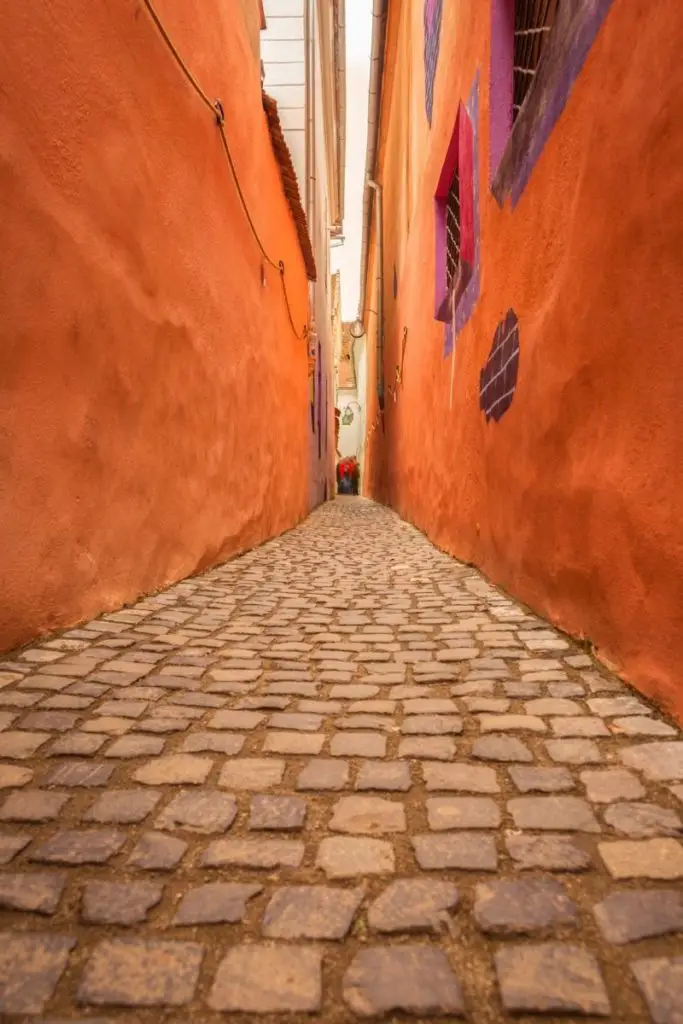Strada Sforii, the narrowest street in Europe, in Brasov, Transylvania, Romania.