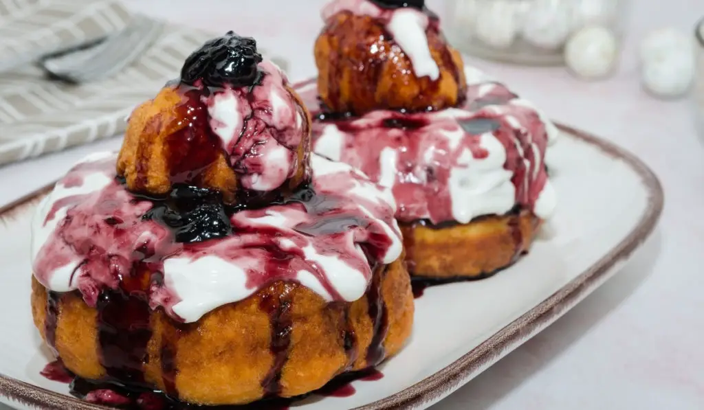 Romanian donuts with sour cream and jam, the most popular Romanian dessert.