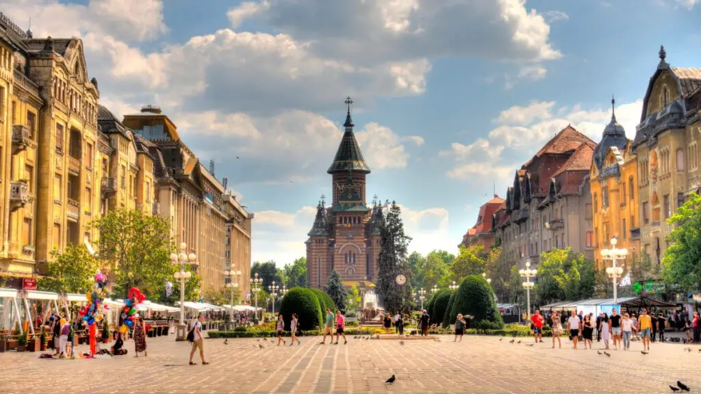 People walking through the beautiful city of Timisoara, Romania.