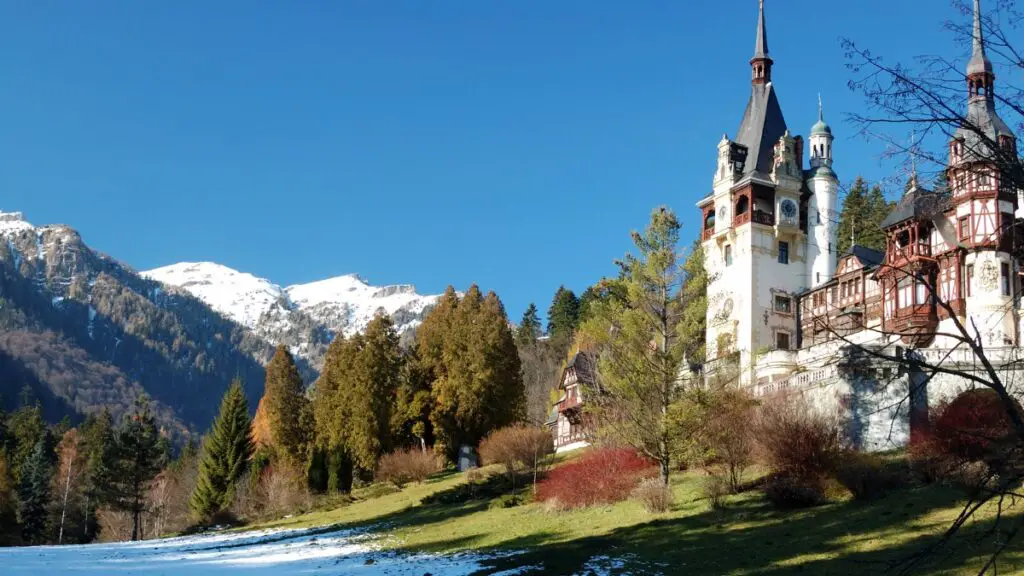 Peles Castle with Carpathian Mountains in background