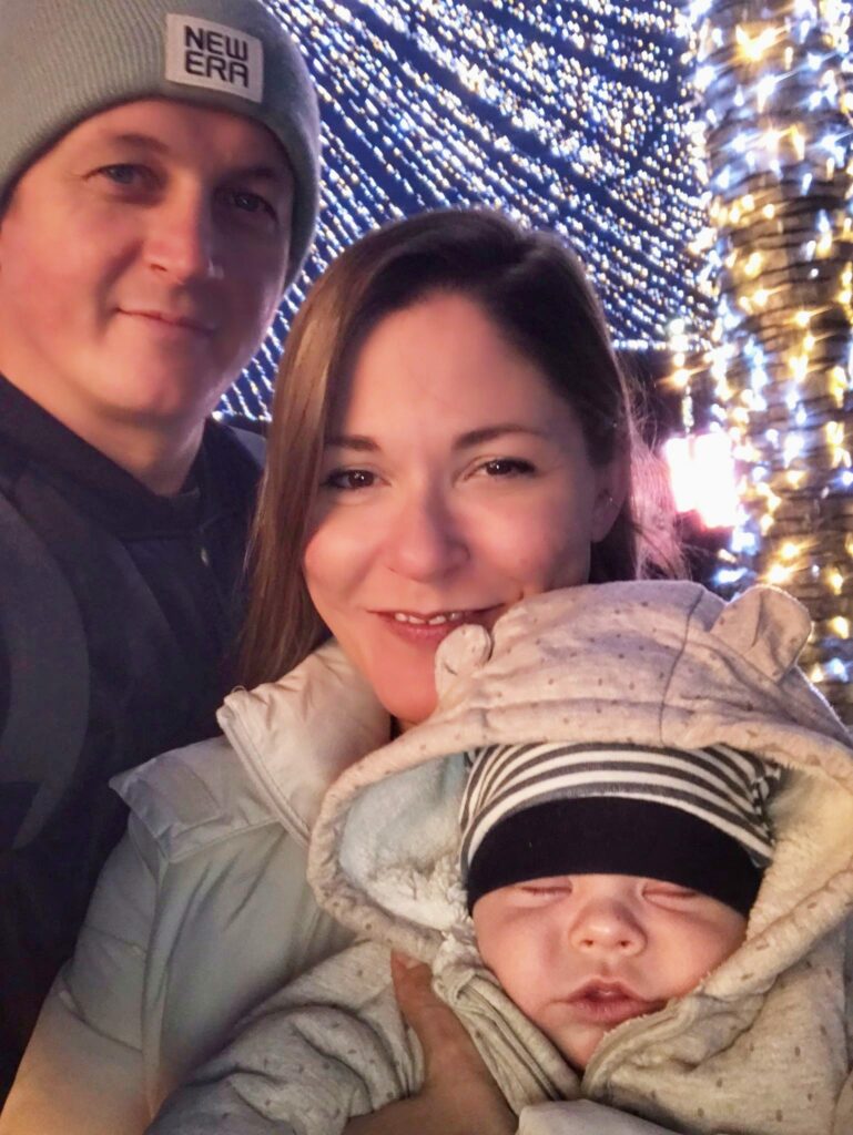 Couple with baby at Cluj Napoca Christmas market.